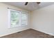 Bedroom featuring a ceiling fan, natural light, and carpet flooring at 166 Still Ave, Fort Mill, SC 29715