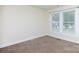 Cozy bedroom with carpet flooring and natural light from a window at 166 Still Ave, Fort Mill, SC 29715