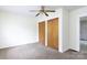Bedroom with a ceiling fan, closet, and a view into another room at 166 Still Ave, Fort Mill, SC 29715