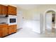 Bright kitchen with oven, refrigerator, and a door to the front yard at 166 Still Ave, Fort Mill, SC 29715