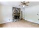 Open living room featuring a unique stone fireplace and neutral paint at 166 Still Ave, Fort Mill, SC 29715