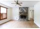 Spacious living room with stone fireplace and hardwood flooring at 166 Still Ave, Fort Mill, SC 29715