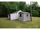 View of several outdoor outbuildings, some with metal cladding and one with wood at 166 Still Ave, Fort Mill, SC 29715