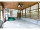 Expansive screened-in porch featuring concrete floors, exposed beams, lattice walls, and access to backyard at 166 Still Ave, Fort Mill, SC 29715