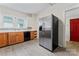 Cozy kitchen with wood cabinets, stainless steel refrigerator and modern backsplash at 18 Douglas Nw Ave, Concord, NC 28025