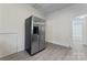 Cozy kitchen with white trim and stainless steel refrigerator at 18 Douglas Nw Ave, Concord, NC 28025
