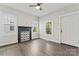 Light filled room featuring vinyl floors, a fireplace, and ample natural light at 18 Douglas Nw Ave, Concord, NC 28025