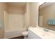 Bathroom features a shower-tub combo and single vanity with sleek countertops at 18711 Ruffner Dr # 1A, Cornelius, NC 28031