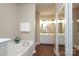 Bright bathroom with a soaking tub, dual vanities, and separate glass door shower at 18711 Ruffner Dr # 1A, Cornelius, NC 28031