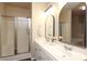 Bathroom features a shower and double vanity with sleek countertops and modern fixtures at 18711 Ruffner Dr # 1A, Cornelius, NC 28031
