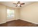 Bedroom with laminate flooring, a ceiling fan, and a window with natural light at 18711 Ruffner Dr # 1A, Cornelius, NC 28031