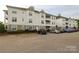 Apartment building offers ample parking spaces and well maintained landscaping at 18711 Ruffner Dr # 1A, Cornelius, NC 28031