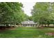 Charming community building nestled amongst lush greenery with a well-manicured lawn at 18711 Ruffner Dr # 1A, Cornelius, NC 28031