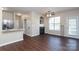 Bright living area features wood floors, a fireplace, and modern ceiling fan at 18711 Ruffner Dr # 1A, Cornelius, NC 28031