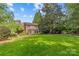 Expansive backyard with lush green lawn and manicured landscaping, perfect for outdoor activities and relaxation at 1949 S Wendover Rd, Charlotte, NC 28211
