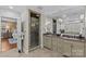 Bathroom featuring glass enclosed shower and double sinks with granite countertops and decorative tile at 1949 S Wendover Rd, Charlotte, NC 28211