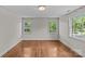 Bright bedroom featuring hardwood floors and large windows offering natural light at 1949 S Wendover Rd, Charlotte, NC 28211