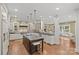 Spacious kitchen featuring a center island, modern appliances, and hardwood flooring at 1949 S Wendover Rd, Charlotte, NC 28211