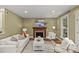 Cozy living room featuring a fireplace, hardwood floors, and stylish furnishings at 1949 S Wendover Rd, Charlotte, NC 28211