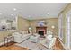 Comfortable living room showcasing a fireplace, hardwood floors, and neutral decor at 1949 S Wendover Rd, Charlotte, NC 28211