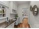 Bright home office with built-in desk and storage, offering a functional workspace at 1949 S Wendover Rd, Charlotte, NC 28211
