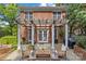 Outdoor stone patio with wood pergola and comfortable seating at 1949 S Wendover Rd, Charlotte, NC 28211