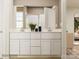 This stylish bathroom features a dual sink vanity with white cabinets and a large mirror above it at 2112 Columbidae Ln, Gastonia, NC 28052