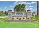 Welcome to The Retreat at Cameron Commons, with a stone entrance sign surrounded by lush landscaping at 2112 Columbidae Ln, Gastonia, NC 28052