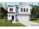 Charming two-story home with a two-car garage, crisp white siding, and a dark blue accent panel at 2112 Columbidae Ln, Gastonia, NC 28052