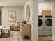 Convenient laundry room features modern washer and dryer, ample storage, and stylish decor for a functional space at 2112 Columbidae Ln, Gastonia, NC 28052