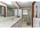 Functional bathroom with long vanity, patterned shower curtain and integrated washer and dryer at 212 Davies Cir, Cleveland, NC 27013