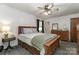 Cozy bedroom with wooden furniture, ceiling fan, and plenty of natural light at 212 Davies Cir, Cleveland, NC 27013