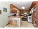 Functional kitchen featuring wooden cabinets, ample counter space, and a cozy breakfast bar at 212 Davies Cir, Cleveland, NC 27013
