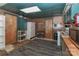 Cozy kitchen with white appliances, green cabinets and worn wood paneling at 212 Davies Cir, Cleveland, NC 27013