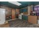 Cozy kitchen with white appliances, green cabinets and worn wood paneling at 212 Davies Cir, Cleveland, NC 27013