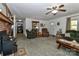 Spacious living room featuring a fireplace, comfortable furniture, and ample natural light at 212 Davies Cir, Cleveland, NC 27013