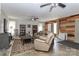 Spacious living room area complete with ceiling fans, a comfortable couch, and cozy rocking chair at 212 Davies Cir, Cleveland, NC 27013