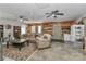 Open living area with ceiling fans, comfortable furniture, and access to the backyard at 212 Davies Cir, Cleveland, NC 27013