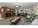 Open living room featuring a brick fireplace, comfortable seating, and a welcoming ambiance at 212 Davies Cir, Cleveland, NC 27013