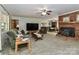 Comfortable living room with a brick fireplace and a large television at 212 Davies Cir, Cleveland, NC 27013