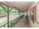Relaxing covered porch featuring ample seating and views of the expansive yard at 212 Davies Cir, Cleveland, NC 27013
