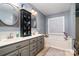 The bathroom features double sinks, with grey cabinets, round mirrors and a decorative cabinet at 2278 Jon Chris Dr, Harrisburg, NC 28075