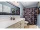 This bathroom features tile flooring, decorative mirror and tile backsplash at 2278 Jon Chris Dr, Harrisburg, NC 28075