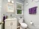 A charming half bathroom featuring a vessel sink, decorative mirror, and updated fixtures at 2278 Jon Chris Dr, Harrisburg, NC 28075