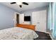 The bedroom has a ceiling fan, hardwood floors and a double closet for storage at 2278 Jon Chris Dr, Harrisburg, NC 28075