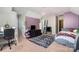 The carpeted bedroom features a chandelier, a small desk and a modern television at 2278 Jon Chris Dr, Harrisburg, NC 28075