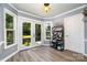 Breakfast nook with French doors leading to the backyard and a coffee and beverage bar at 2278 Jon Chris Dr, Harrisburg, NC 28075