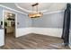 Bright dining room with modern lighting and hardwood floors, perfect for Gathering meals at 2278 Jon Chris Dr, Harrisburg, NC 28075