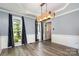 Bright dining room with modern lighting and hardwood floors, perfect for Gathering meals at 2278 Jon Chris Dr, Harrisburg, NC 28075