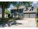 Charming two-story home with a well-manicured lawn, complemented by a wide driveway and a two-car garage at 2278 Jon Chris Dr, Harrisburg, NC 28075